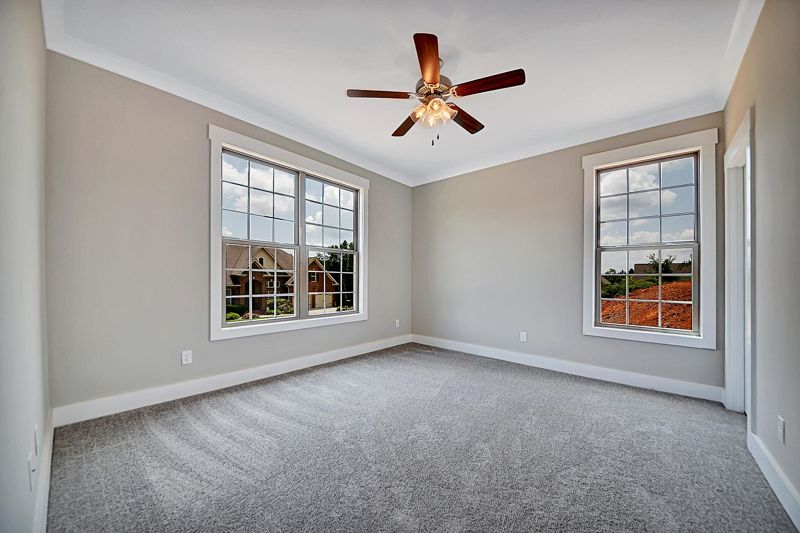 Primary bedroom with ceiling fan