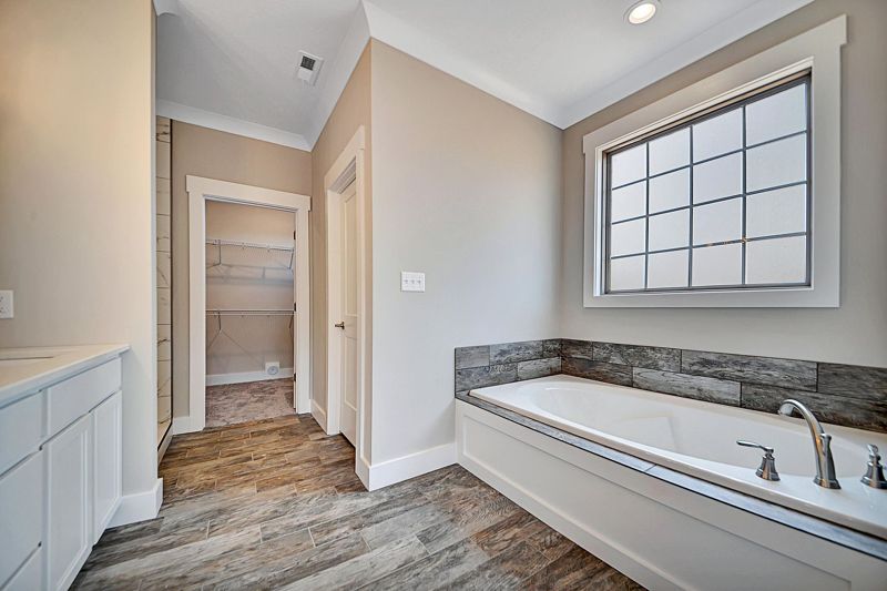 Primary bath with a soaking tub and double vanity