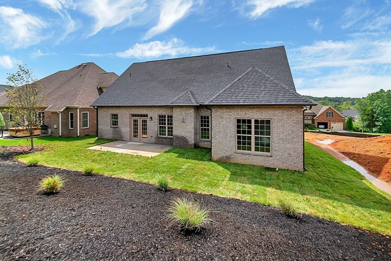 Rear exterior with a covered patio