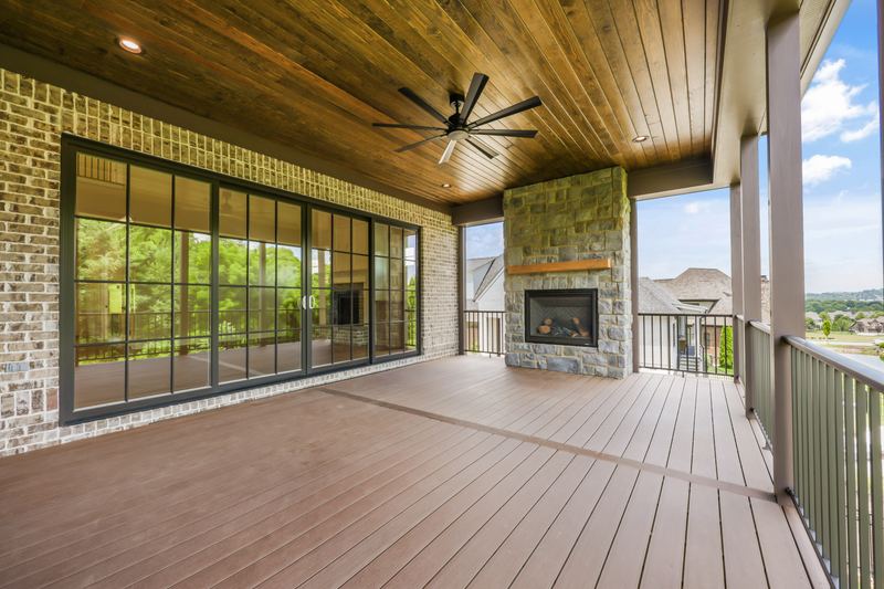 Covered rear porch with stone fireplace