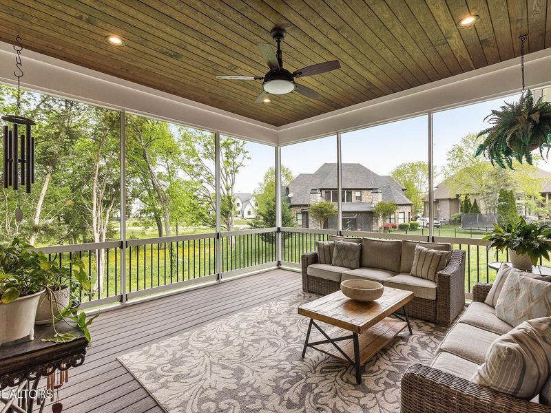 Screened porch with wood ceiling