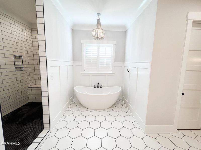 Primary bath with freestanding tub and hex tile