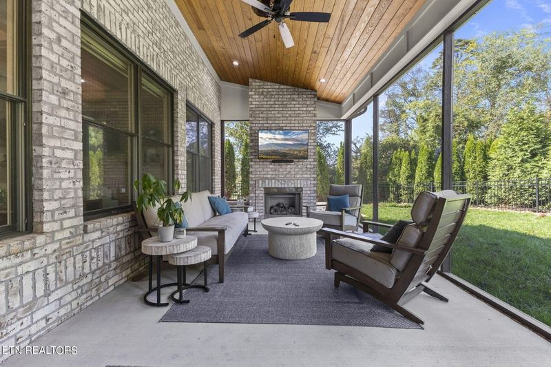 Screened porch with stone fireplace