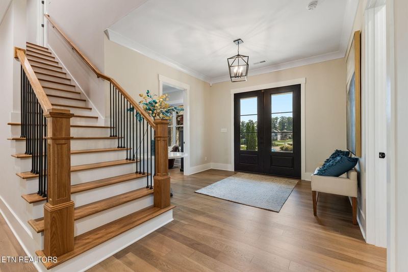 Foyer with staircase and glass entry doors